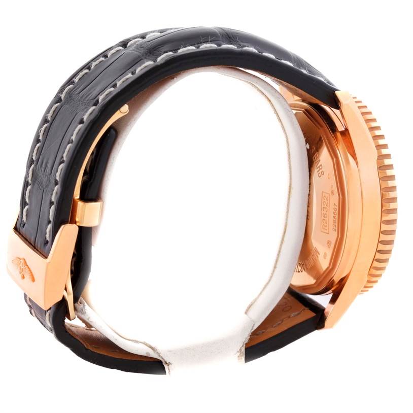 The image shows a side view of a Breitling Navitimer R26322 Men's Rose Gold Black Dial R26322 Men's Rose Gold Black Dial watch highlighting the back case, crown, and strap with clasp.
