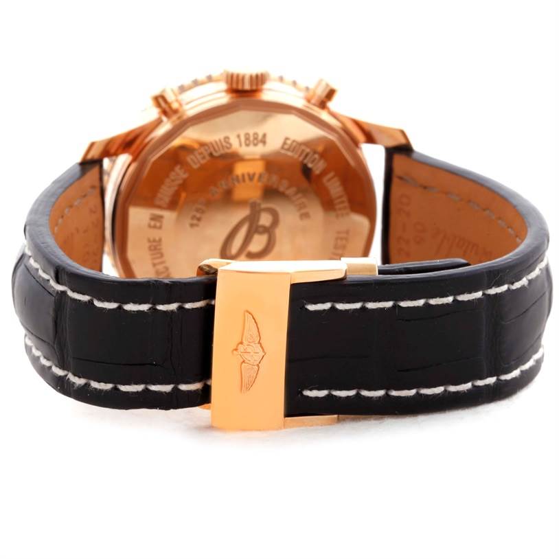 This image shows the back and leather strap of a Breitling Navitimer R26322 Men's Rose Gold Black Dial R26322 Men's Rose Gold Black Dial watch, featuring a gold clasp and case back.