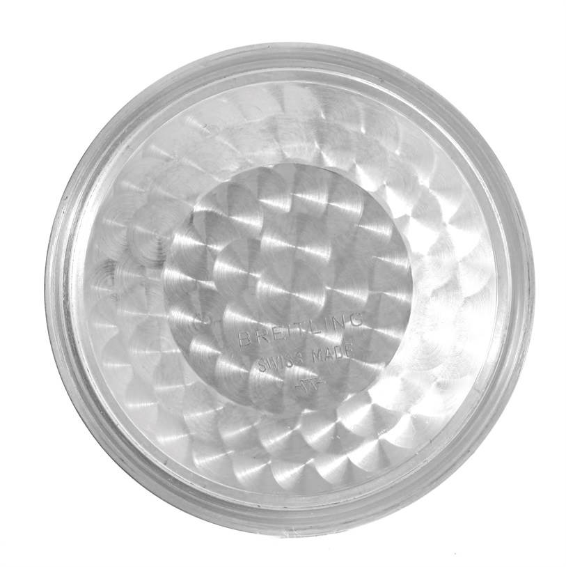 The image shows a close-up, top-down view of the back cover for a Breitling Navitimer A24322 Men
s Stainless Steel Black Dial A24322 Men
s Stainless Steel Black Dial watch.