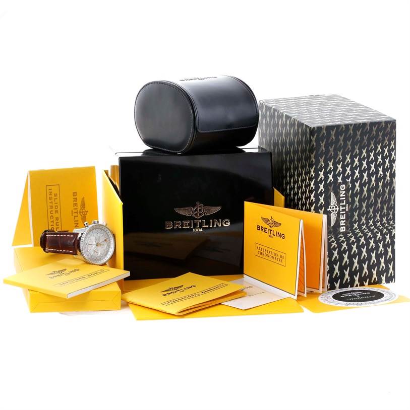 The image shows a Breitling Navitimer A24322 Men's Stainless Steel Silver Dial A24322 Men's Stainless Steel Silver Dial watch alongside its box, case, and various instruction manuals.