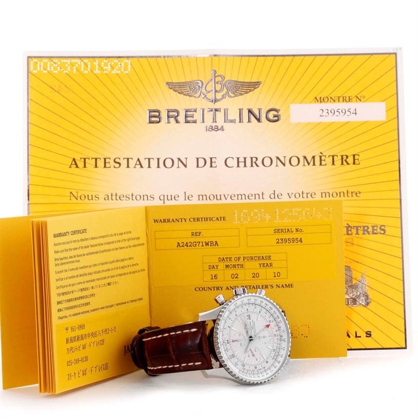 The image shows a Breitling Navitimer A24322 Men's Stainless Steel Silver Dial A24322 Men's Stainless Steel Silver Dial watch, warranty certificate, and chronometer attestation document at a slight angle.
