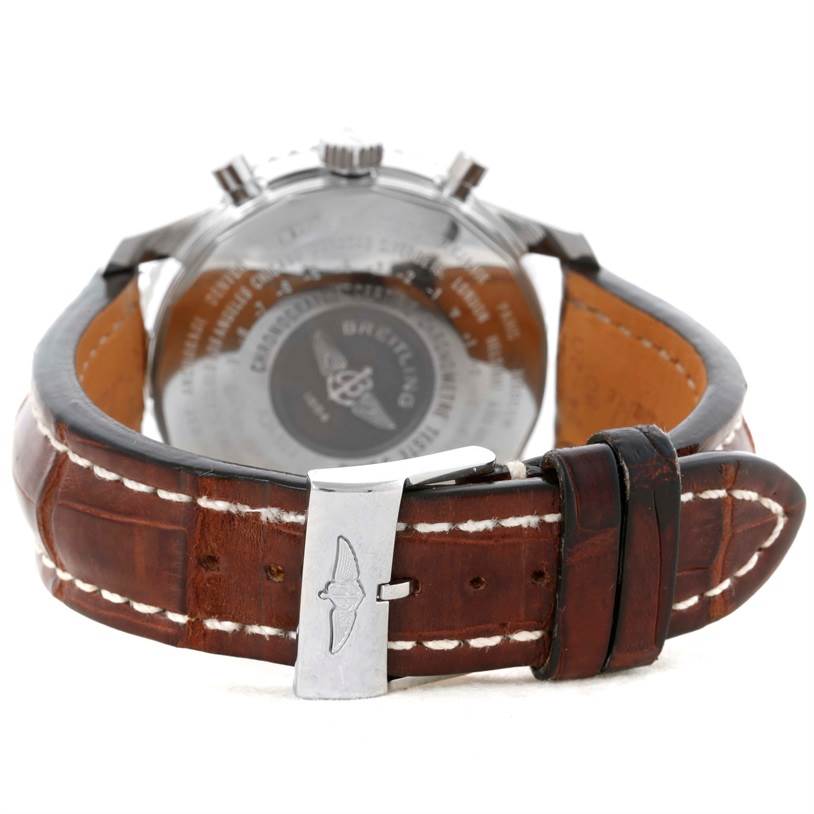 The photo shows the back view of the Breitling Navitimer A24322 Men's Stainless Steel Silver Dial A24322 Men's Stainless Steel Silver Dial watch, highlighting the watch case, the leather strap, and the clasp.