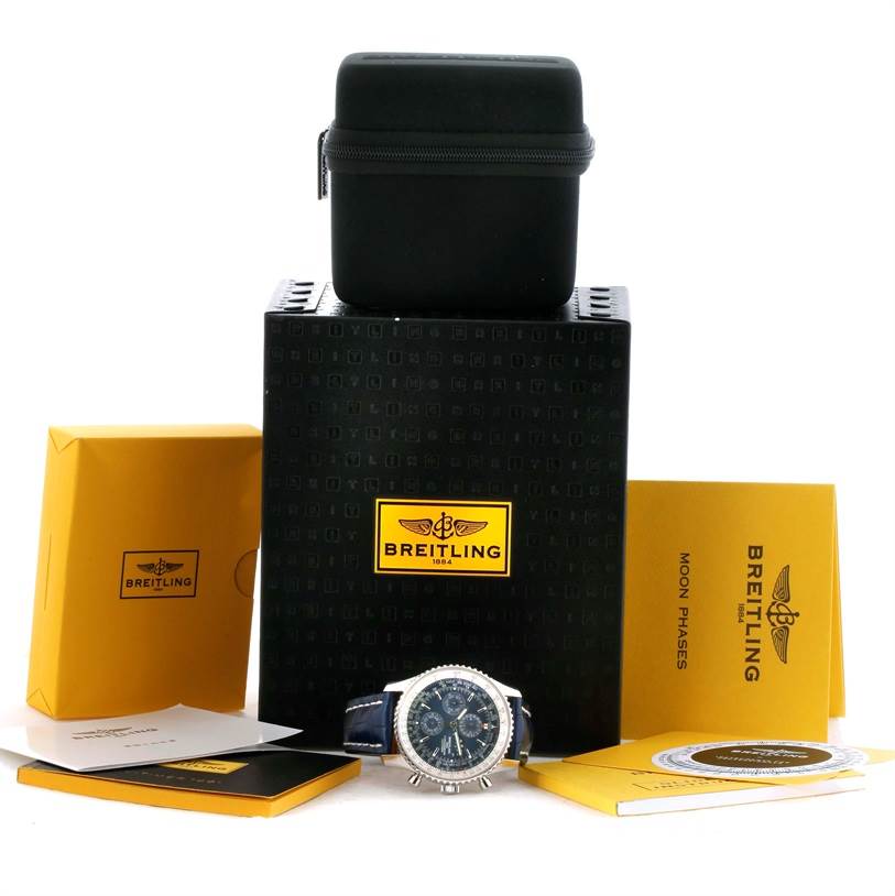 The image shows a front angle of the Breitling Navitimer A19370 Men's Stainless Steel Blue Dial A19370 Men's Stainless Steel Blue Dial watch with its box, case, manuals, and warranty cards.