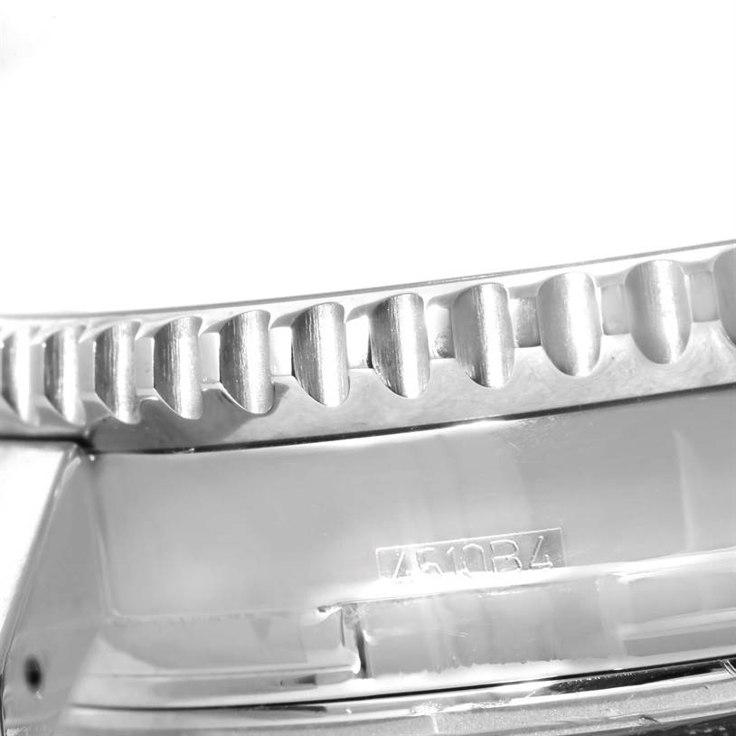 This image shows a close-up of the bezel and part of the case of a Breitling Navitimer A24322 Men's Stainless Steel Black Dial A24322 Men's Stainless Steel Black Dial watch, highlighting the model's serrated edge.