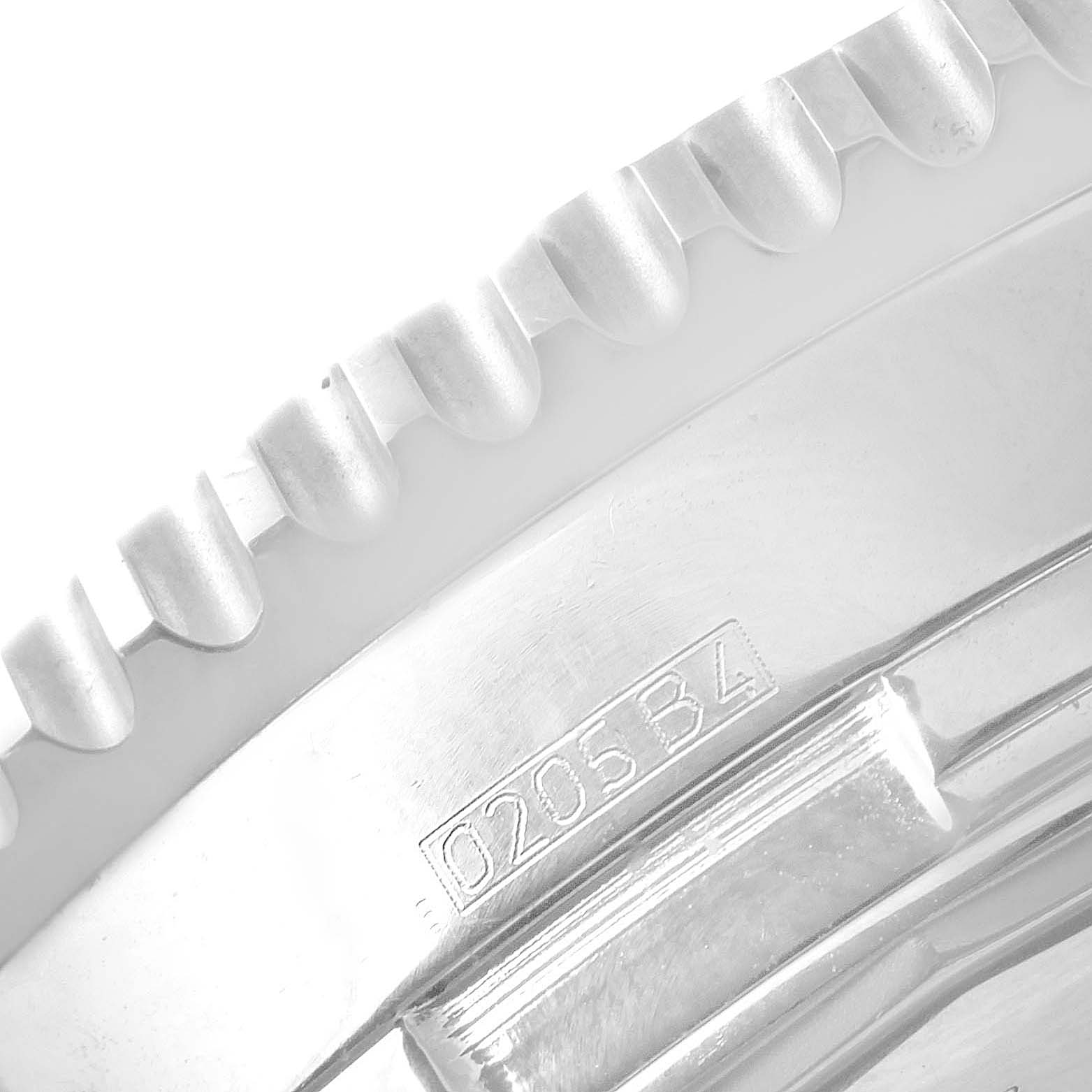 The image shows a close-up angle of the bezel and a part of the caseback engraving of the Breitling Navitimer A24322 Men's Stainless Steel Blue Dial A24322 Men's Stainless Steel Blue Dial watch.