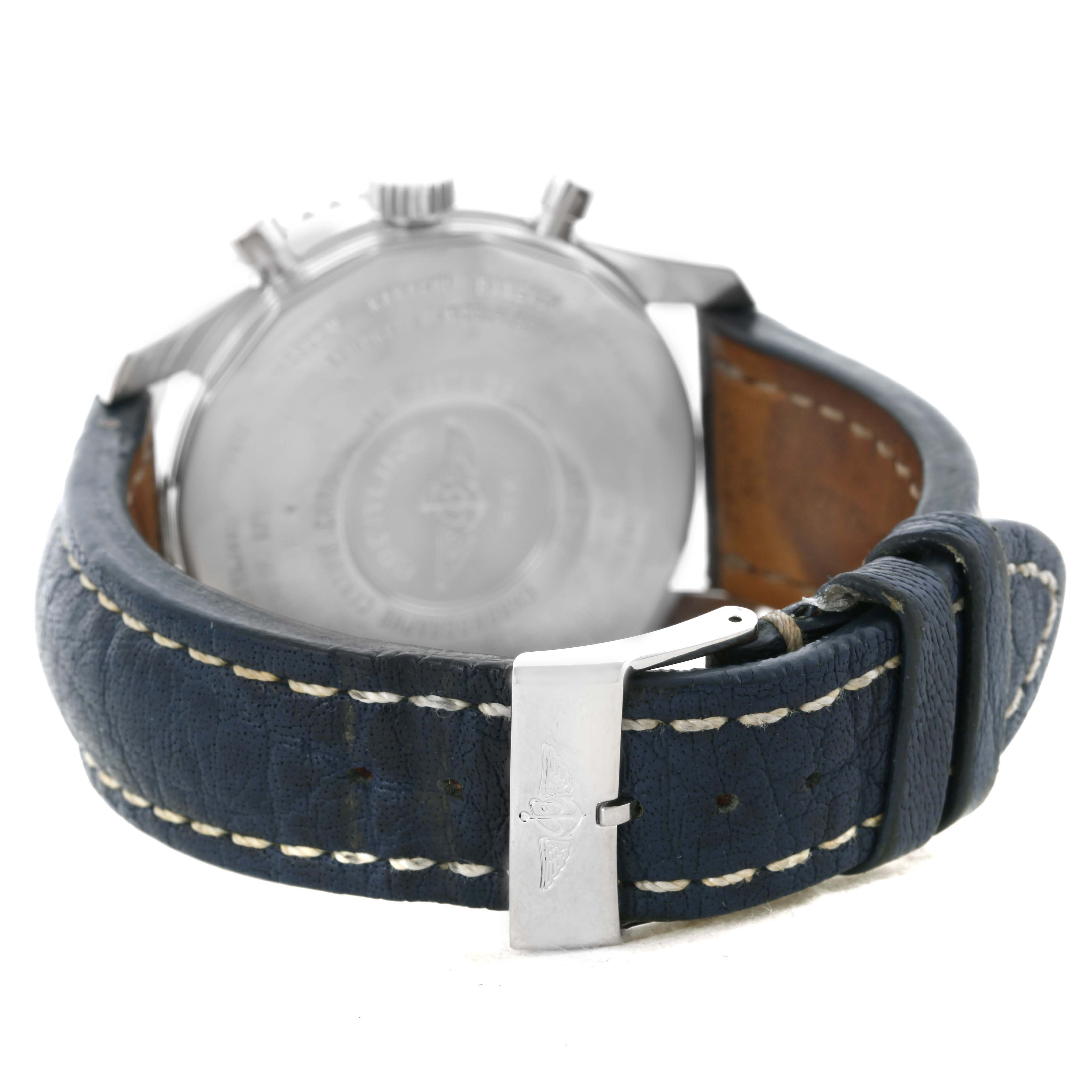 The image shows the back of a Breitling Navitimer A24322 Men's Stainless Steel Blue Dial A24322 Men's Stainless Steel Blue Dial watch and its leather strap with a metal clasp.