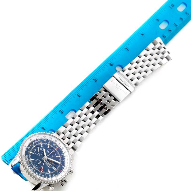 The Breitling Navitimer A24322 Men's Stainless Steel Blue Dial A24322 Men's Stainless Steel Blue Dial watch is shown from a top-down angle, displaying the face, bezel, and metal bracelet next to a blue ruler.