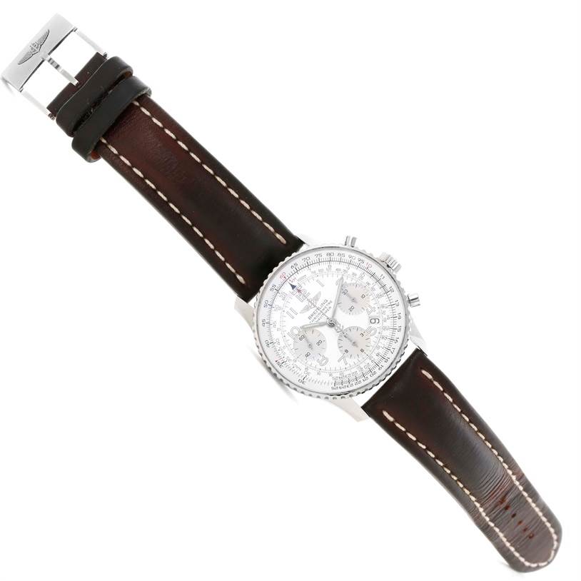 The Breitling Navitimer A23322 Men's Stainless Steel Silver Dial A23322 Men's Stainless Steel Silver Dial watch is shown from an angled top view, highlighting the face, bezel, and leather strap with buckle.