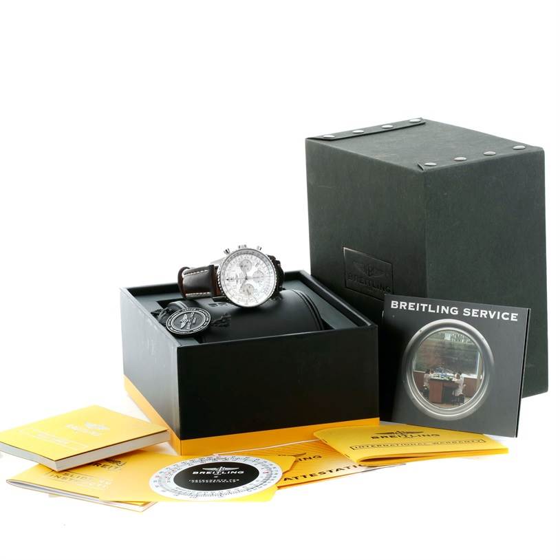 This image shows a Breitling Navitimer A23322 Men's Stainless Steel Silver Dial A23322 Men's Stainless Steel Silver Dial watch with its box, manuals, and accessories from a slightly elevated front angle.