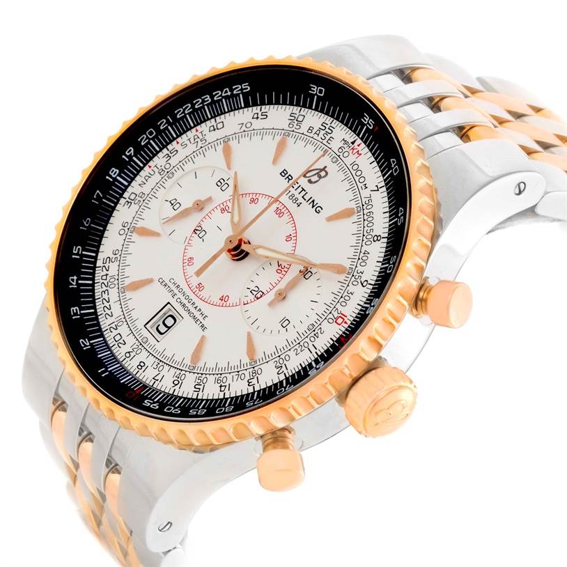 This image shows a side angle of a Breitling Navitimer C23340 Men
s Steel and Gold (two tone) Silver Dial C23340 Men
s Steel and Gold (two tone) Silver Dial watch, highlighting its dial, bezel, crown, and part of the bracelet.