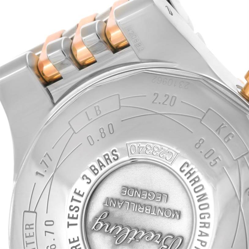 The image shows a close-up view of the case back and part of the bracelet of a Breitling Navitimer C23340 Men
s Steel and Gold (two tone) Silver Dial C23340 Men
s Steel and Gold (two tone) Silver Dial watch.