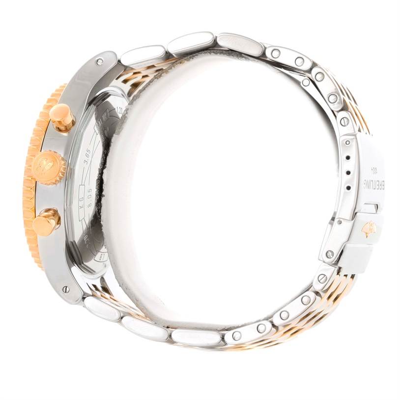 This image shows a side view of the Navitimer model by Breitling, highlighting the crown, pushers, and part of the bracelet.