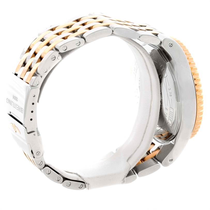 The image shows the side view of a Breitling Navitimer C23340 Men
s Steel and Gold (two tone) Silver Dial C23340 Men
s Steel and Gold (two tone) Silver Dial watch, focusing on the bracelet and case.