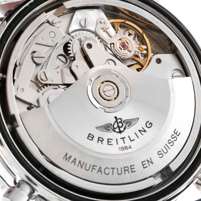 The image shows a close-up of the back of a Breitling Navitimer A13022 Men's Stainless Steel Blue Dial A13022 Men's Stainless Steel Blue Dial watch, revealing its mechanical movement.