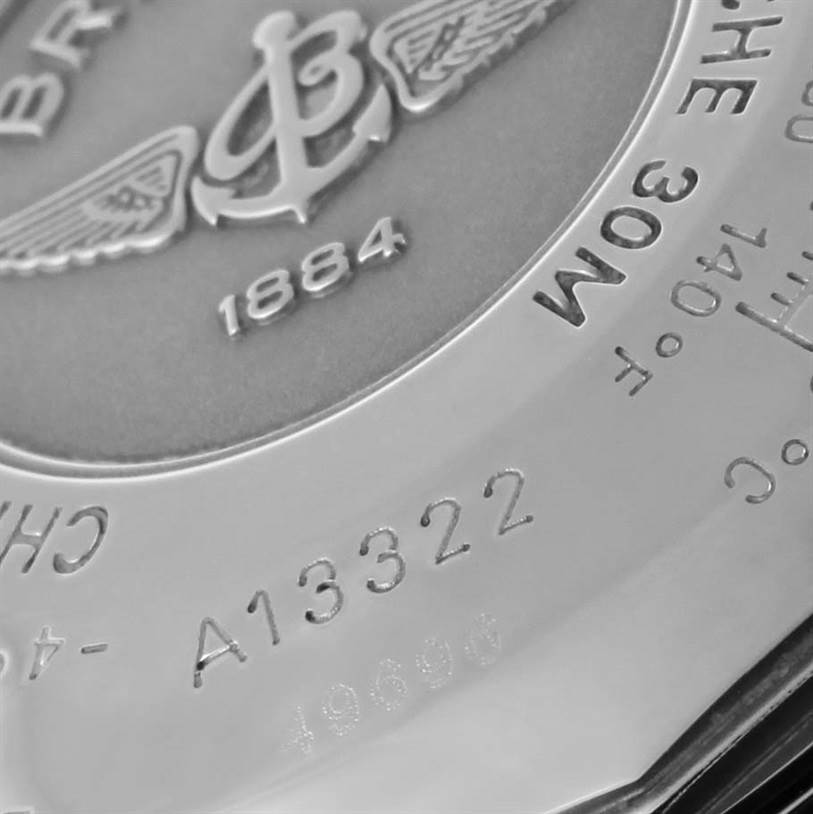 This image shows a close-up of the back case of a Breitling Navitimer A13322 Men's Stainless Steel Blue Dial A13322 Men's Stainless Steel Blue Dial watch, highlighting the engravings and logo.