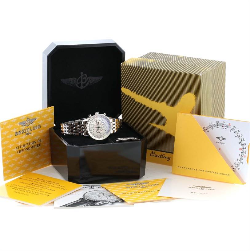 The image shows a Breitling Navitimer A41330 Men's Stainless Steel Silver Dial A41330 Men's Stainless Steel Silver Dial watch with its box, warranty cards, and manuals, displayed on a flat surface.
