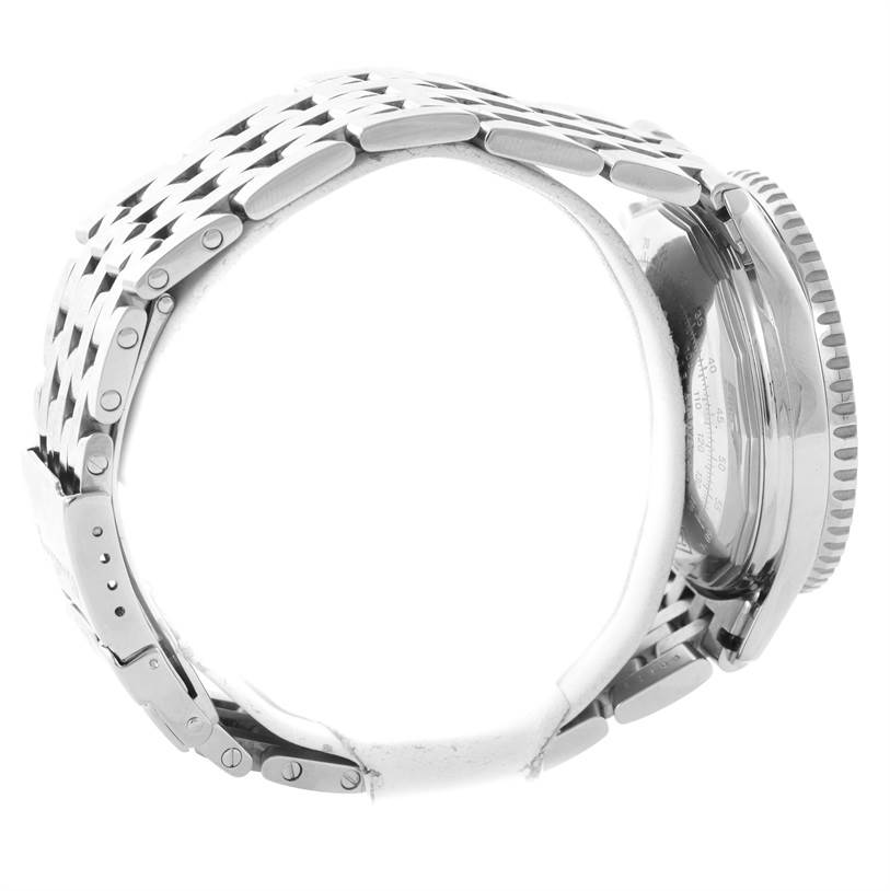 The image showcases a side view of a Breitling Navitimer A13022 Men
s Stainless Steel Blue Dial A13022 Men
s Stainless Steel Blue Dial watch focusing on its metal bracelet and partially visible case back.