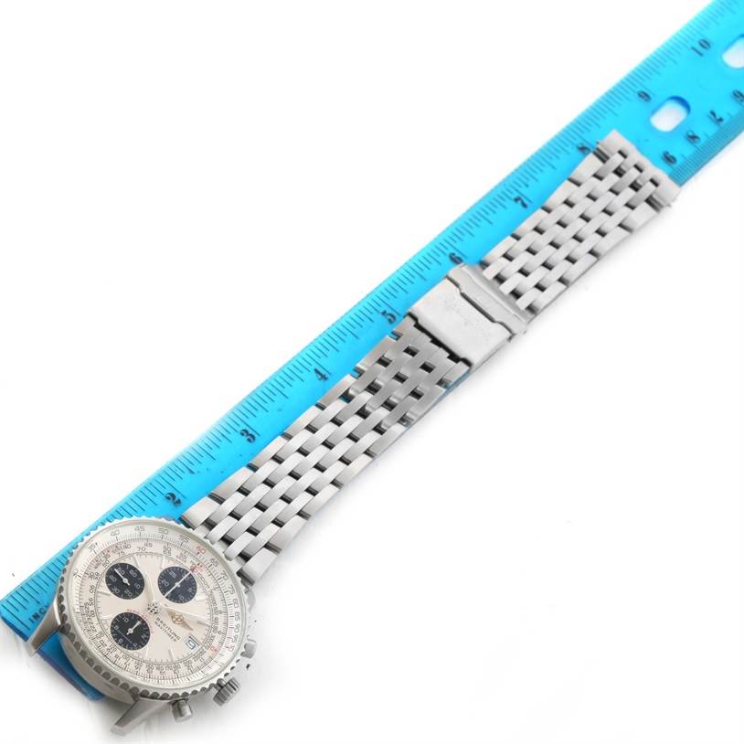 The image shows a Breitling Navitimer A13330 Men's Stainless Steel Silver Dial A13330 Men's Stainless Steel Silver Dial watch laid flat with a metal bracelet, alongside a blue ruler for scale.