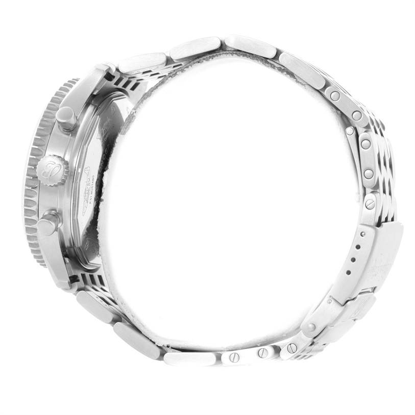 The image shows a side view of a Breitling Navitimer A13330 Men's Stainless Steel Silver Dial A13330 Men's Stainless Steel Silver Dial watch, highlighting the case, crown, pushers, and metal bracelet.