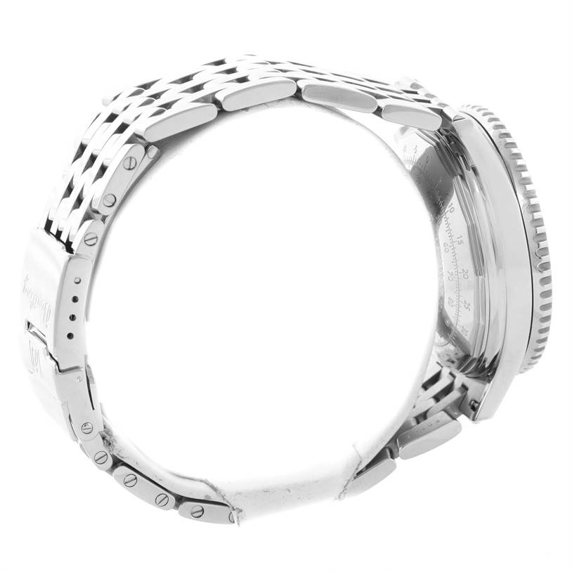 The image shows a side view of the case, bezel, and metal bracelet of a Navitimer model by Breitling.