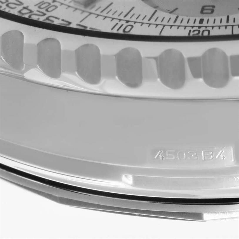 The image shows a close-up of the bezel and part of the dial of a Breitling Navitimer A23322 Men's Stainless Steel Silver Dial A23322 Men's Stainless Steel Silver Dial watch.