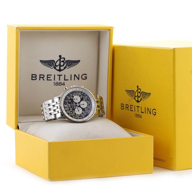 This image shows a Breitling Navitimer A12022 Men
s Stainless Steel Black Dial A12022 Men
s Stainless Steel Black Dial watch inside a yellow Breitling box, displayed at an angle highlighting the face and bracelet.