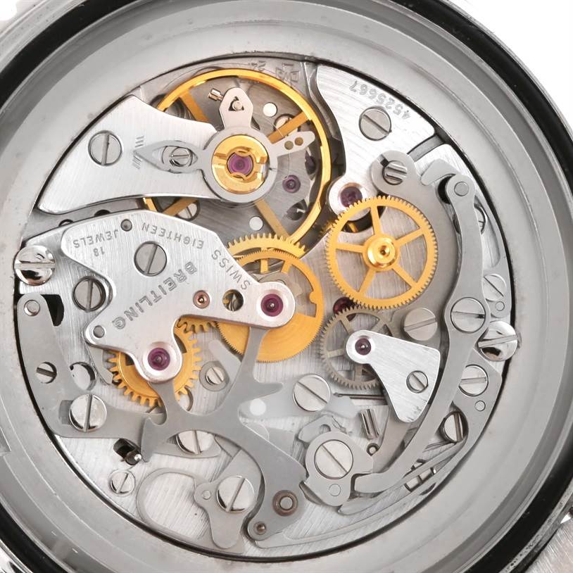 The image shows the intricate movement mechanism of a Breitling Navitimer A12022 Men
s Stainless Steel Black Dial A12022 Men
s Stainless Steel Black Dial watch from a back view angle.