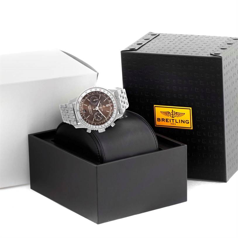 The Breitling Navitimer A26322 Men's Stainless Steel Brown Dial A26322 Men's Stainless Steel Brown Dial watch is shown at a slight angle, displayed on a black cushion inside its open black box with the Breitling logo.