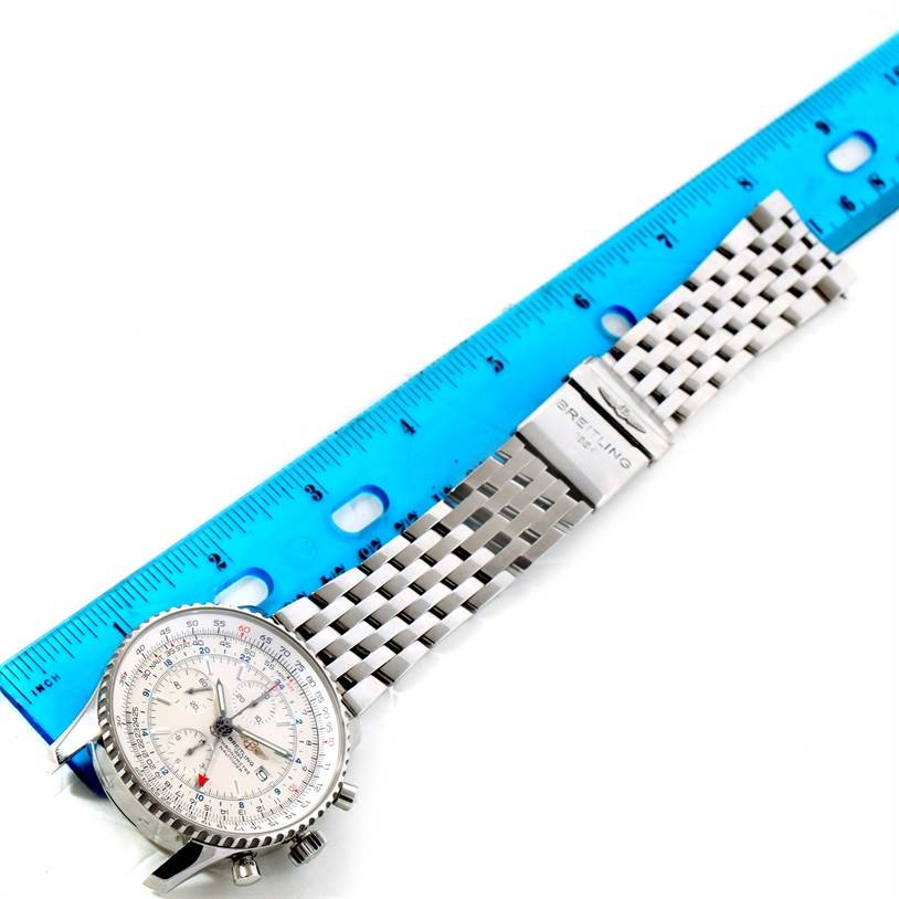 This Breitling Navitimer A24322 Men's Stainless Steel Silver Dial A24322 Men's Stainless Steel Silver Dial is shown from an angle displaying the watch face, metal bracelet, and clasp, alongside a blue ruler.