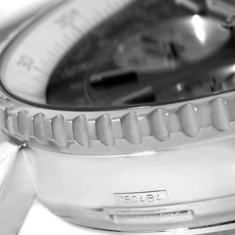 This close-up image shows the bezel, part of the dial, and case of a Breitling Navitimer A23322 Men's Stainless Steel Black Dial A23322 Men's Stainless Steel Black Dial watch.