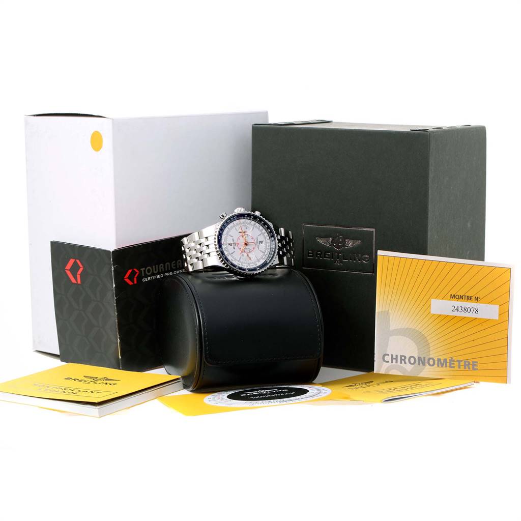 The image shows a Breitling Navitimer A23340 Men's Stainless Steel Silver Dial A23340 Men's Stainless Steel Silver Dial watch on a black cushion, with its box, warranty cards, and documentation displayed.