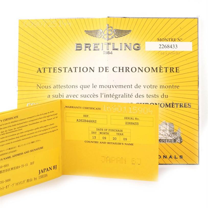 The image shows a Breitling Navitimer A26322 Men's Stainless Steel Black Dial A26322 Men's Stainless Steel Black Dial watch's warranty certificate and chronometer attestation documents from the front angle.