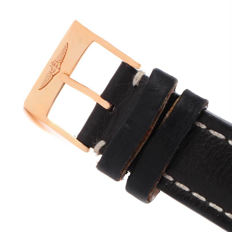 This image shows a close-up of the buckle and part of the leather strap for the Breitling Navitimer RB0120 Men's Rose Gold Black Dial RB0120 Men's Rose Gold Black Dial watch.