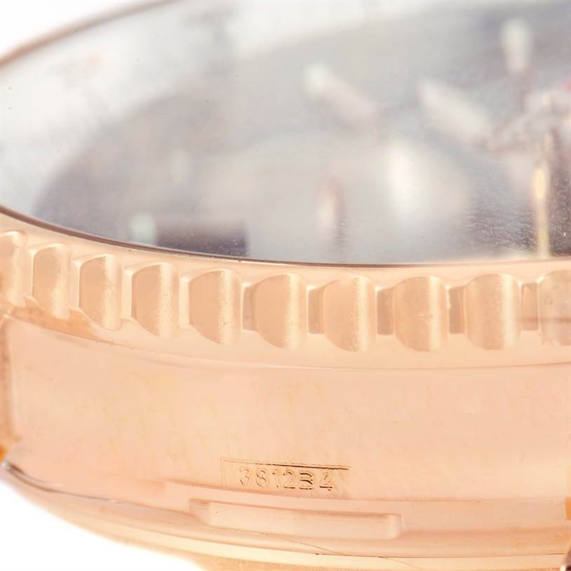 The image shows a close-up side view of the bezel and case of a Breitling Navitimer RB0120 Men's Rose Gold Black Dial RB0120 Men's Rose Gold Black Dial watch, highlighting its knurled edge and part of the crystal.