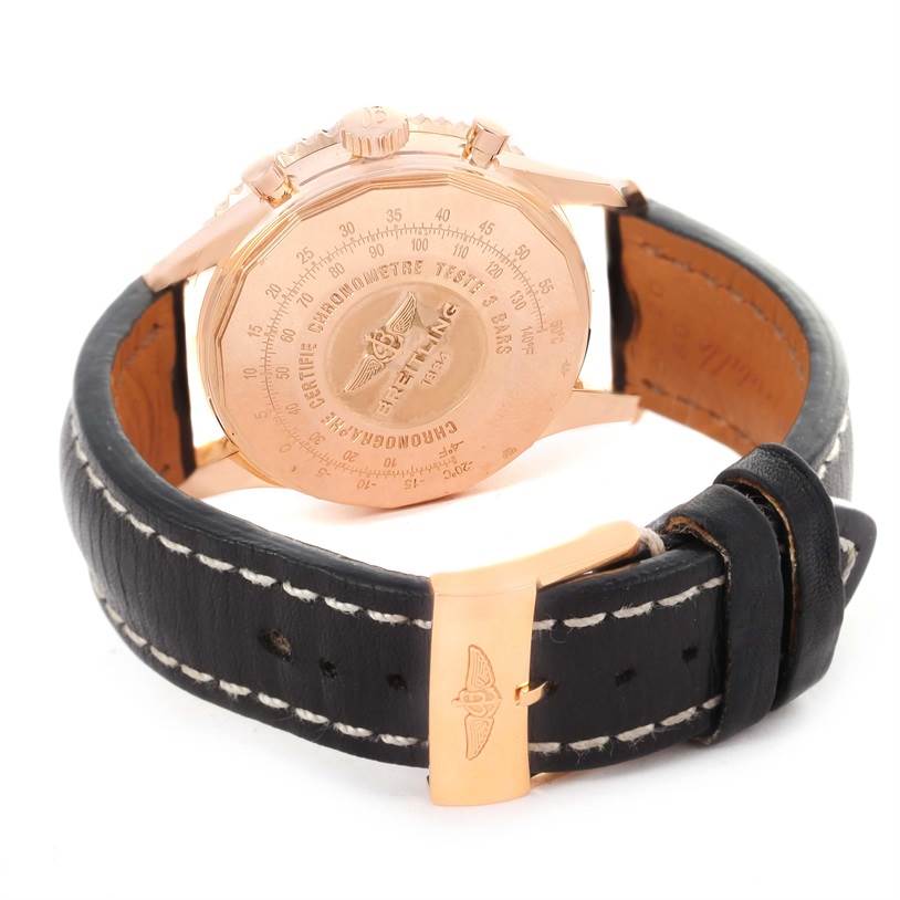 The image shows the back case and strap of a Breitling Navitimer RB0120 Men's Rose Gold Black Dial RB0120 Men's Rose Gold Black Dial watch, highlighting its engraved details and buckle.
