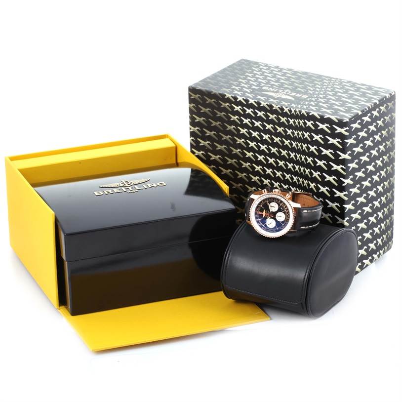 The image shows a Breitling Navitimer RB0120 Men's Rose Gold Black Dial RB0120 Men's Rose Gold Black Dial watch with its packaging, including a luxury box and a travel case.