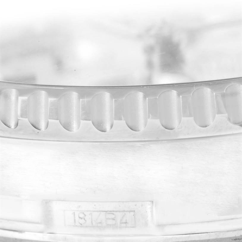 This image shows a close-up of the bezel and a part number engraving of a Breitling Navitimer A24322 Men's Stainless Steel Silver Dial A24322 Men's Stainless Steel Silver Dial watch.