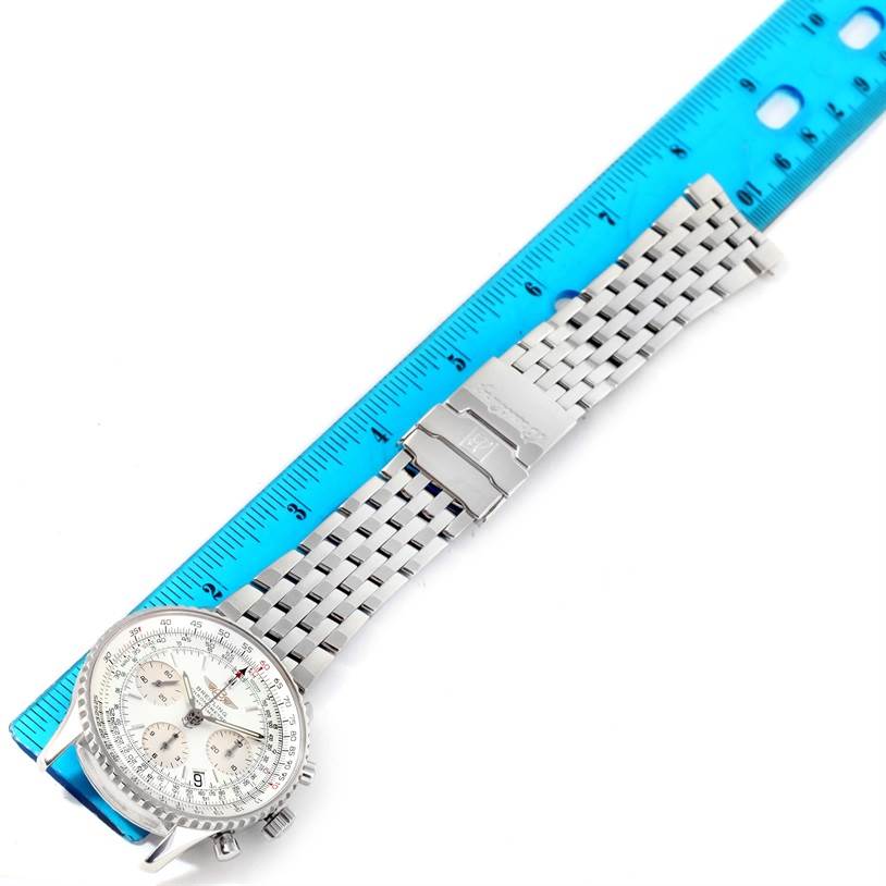 The image shows a Breitling Navitimer A23322 Men's Stainless Steel Silver Dial A23322 Men's Stainless Steel Silver Dial watch laid flat, with its metal bracelet aligned alongside a blue ruler for measurement.