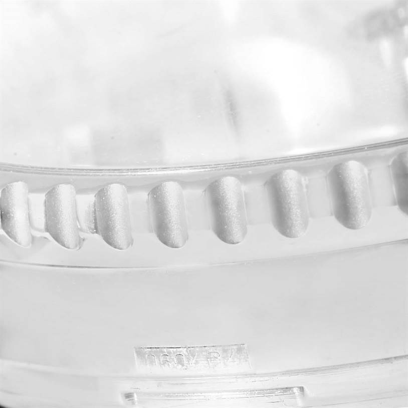 The image shows a close-up of the textured bezel part of a Breitling Navitimer A23322 Men's Stainless Steel Silver Dial A23322 Men's Stainless Steel Silver Dial watch.