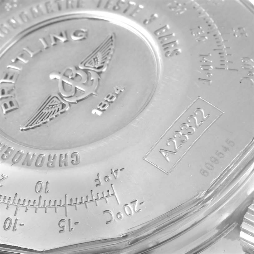 The image shows a close-up of the back case of a Breitling Navitimer A23322 Men's Stainless Steel Silver Dial A23322 Men's Stainless Steel Silver Dial watch, featuring the logo, model number, and various engravings.