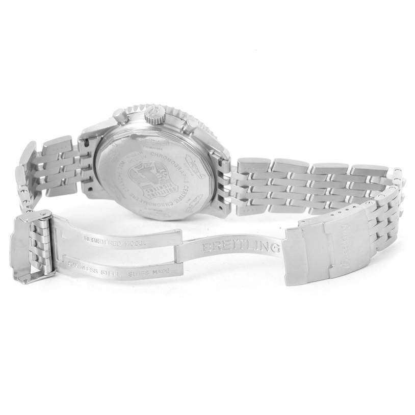 The image shows the back and partially open clasp of the Navitimer model by Breitling in a rear-facing angle.