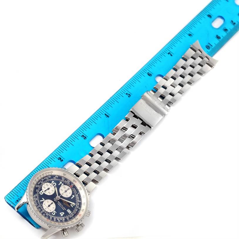 The image shows the Breitling Navitimer A13022 Men
s Stainless Steel Blue Dial A13022 Men
s Stainless Steel Blue Dial watch face-on, placed next to a ruler, illustrating the watch and its metal bracelet.