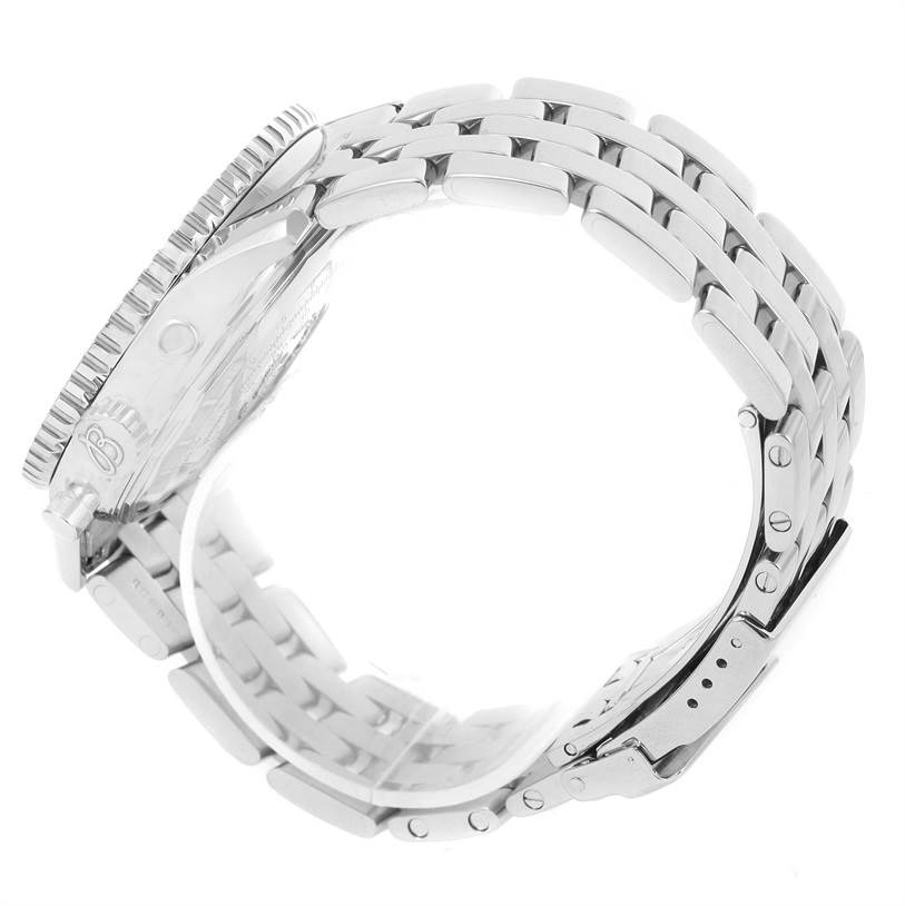 The image shows a side view of the Breitling Navitimer A13022 Men
s Stainless Steel Blue Dial A13022 Men
s Stainless Steel Blue Dial watch, focusing on the case, crown, bezel, and metal bracelet.