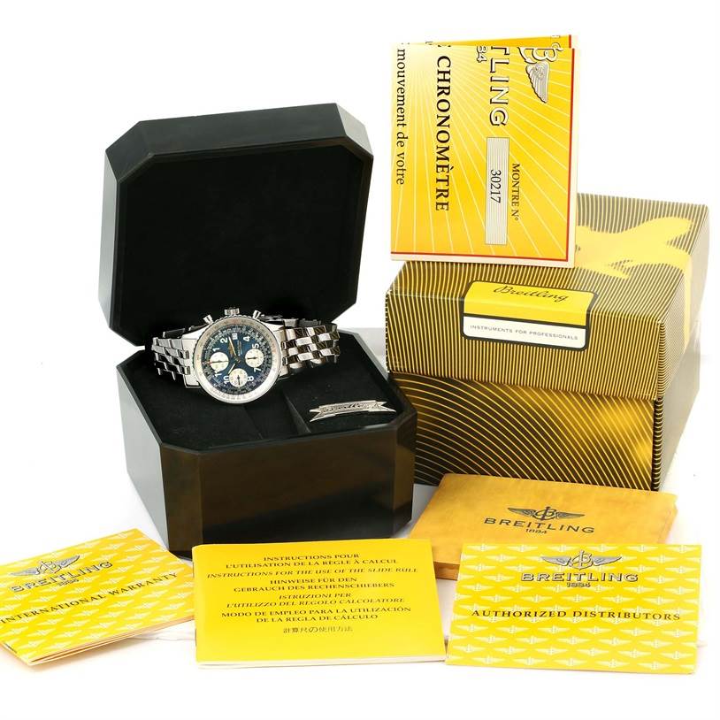 The Breitling Navitimer A13022 Men
s Stainless Steel Blue Dial A13022 Men
s Stainless Steel Blue Dial watch is shown at a front angle, in its open box, alongside manuals, certificates, and packaging.