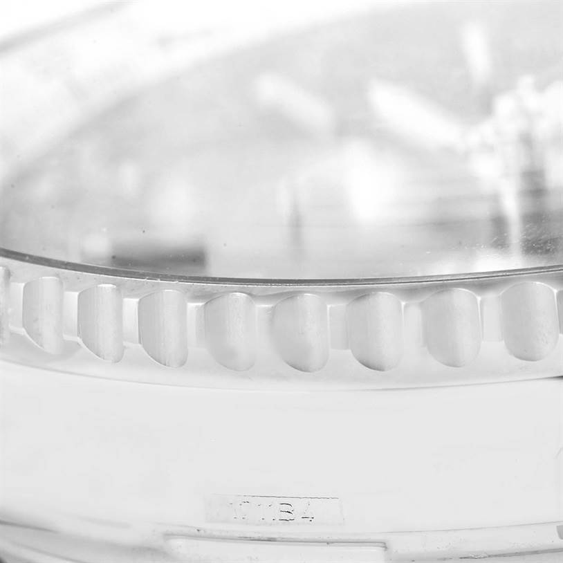 This close-up shot of the Breitling Navitimer AB0120 Men
s Stainless Steel Black Dial AB0120 Men
s Stainless Steel Black Dial model shows the side of the bezel and part of the case.