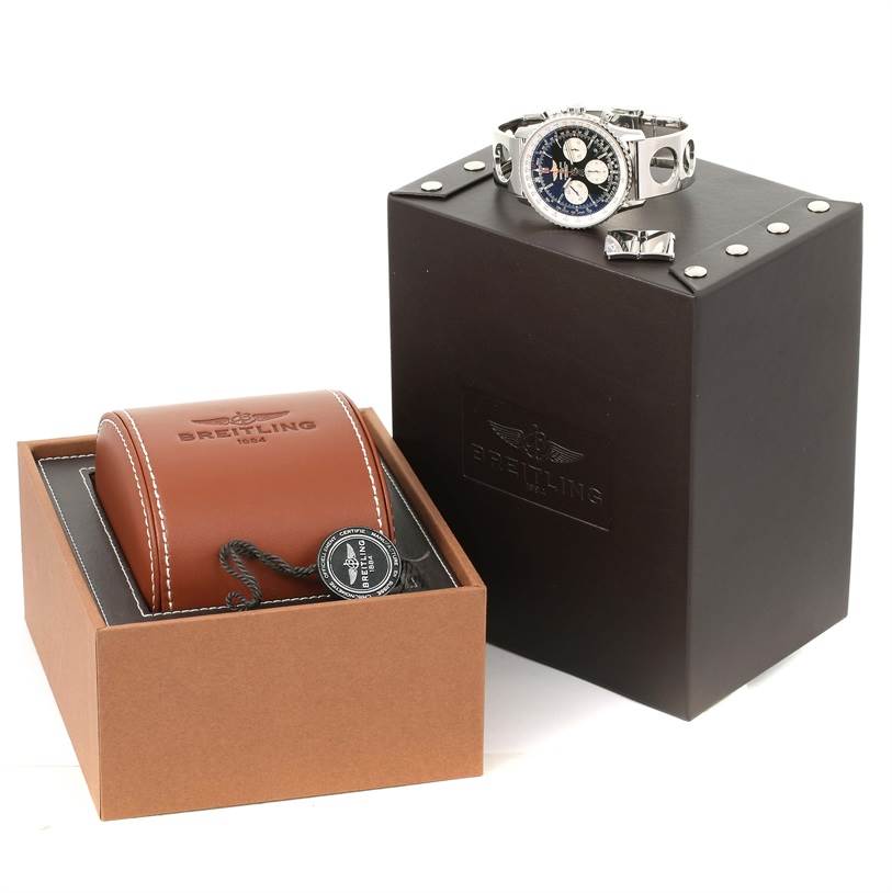 The image shows a Breitling Navitimer AB0120 Men
s Stainless Steel Black Dial AB0120 Men
s Stainless Steel Black Dial watch, its brown leather box, and a black presentation case from a slight high-angle view.