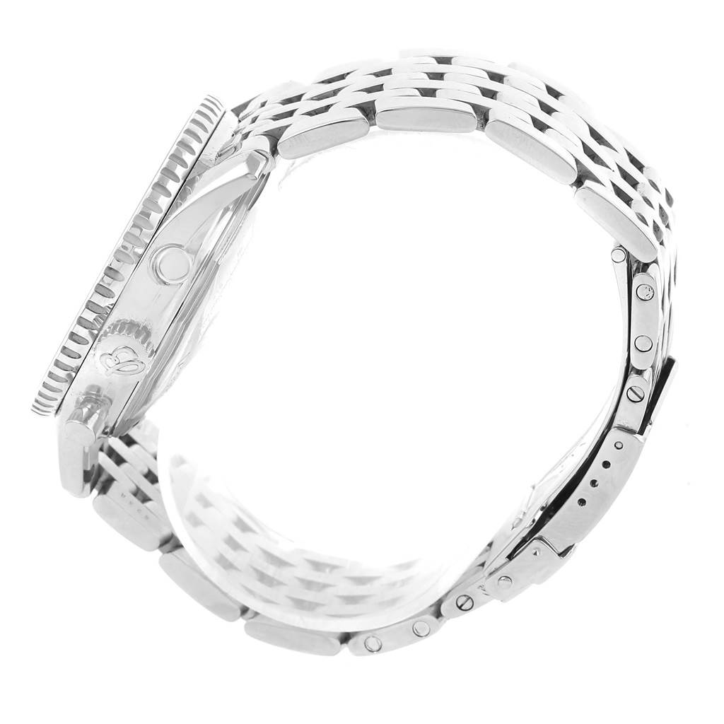 This side view of the Breitling Navitimer A13022 Men's Stainless Steel  A13022 Men's Stainless Steel  watch showcases its bezel, case, crown, and metal bracelet.