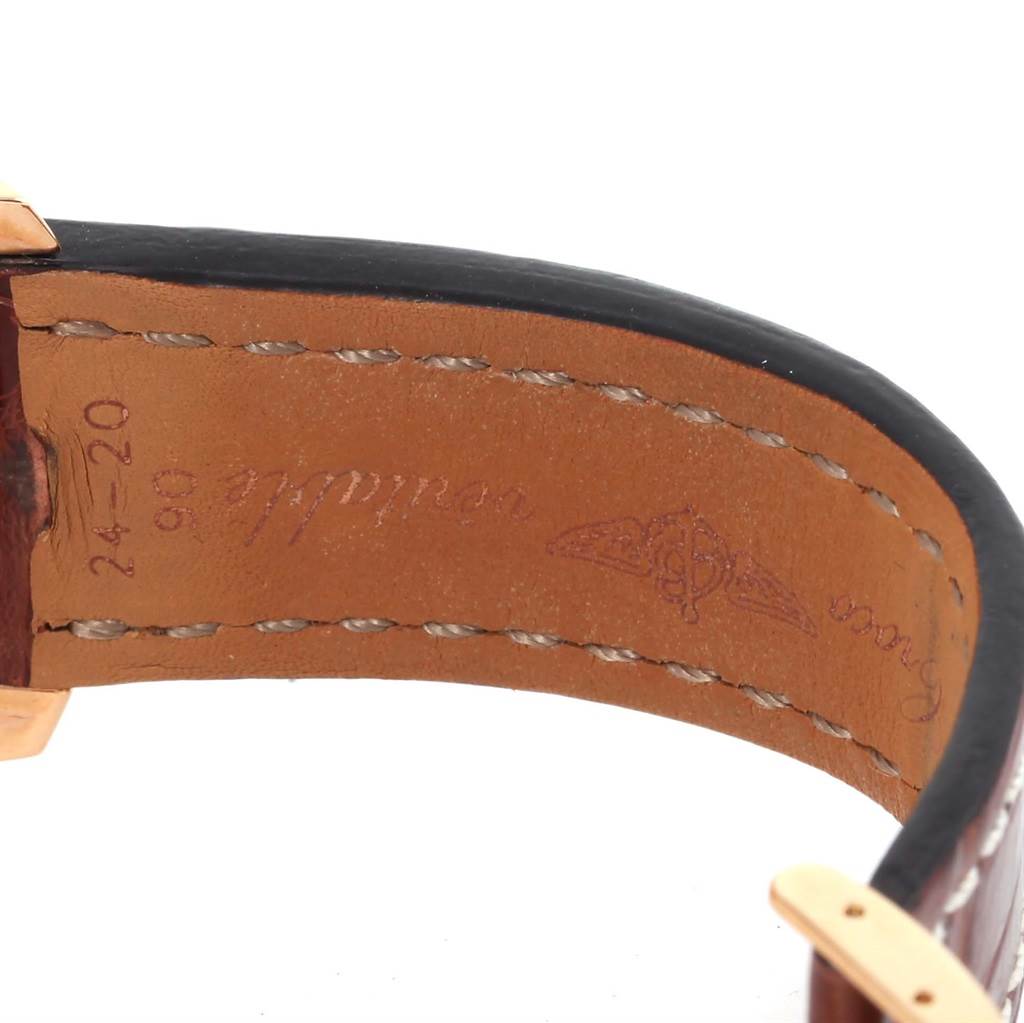 The image shows a close-up of the leather strap of a Breitling Navitimer R24322 Men's Rose Gold Black Dial R24322 Men's Rose Gold Black Dial watch, focusing on the stitching and branding on the interior side.
