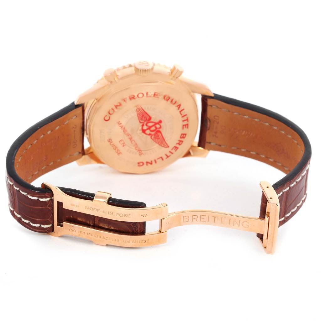 The image shows the back of a Breitling Navitimer R24322 Men's Rose Gold Black Dial R24322 Men's Rose Gold Black Dial watch, featuring its closed clasp and leather strap.