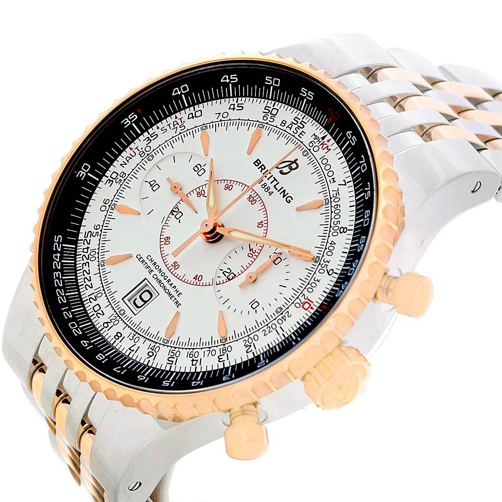 This image shows the dial, bezel, crown, and partial bracelet of the Breitling Navitimer C23340 Men's Steel and Gold (two tone) Silver Dial C23340 Men's Steel and Gold (two tone) Silver Dial watch at an angled close-up view.